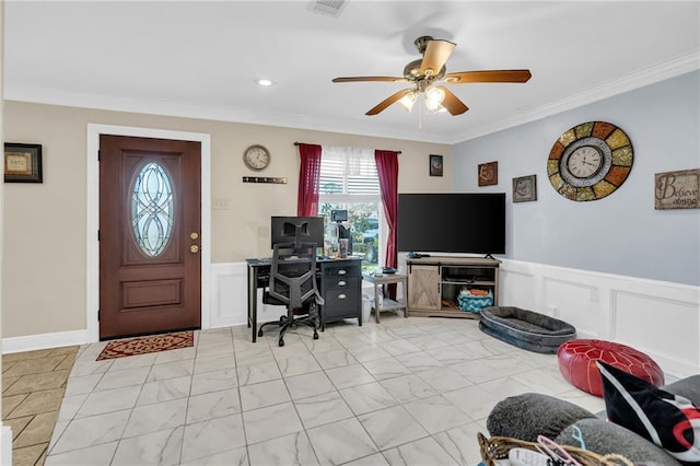 office space with ceiling fan and crown molding