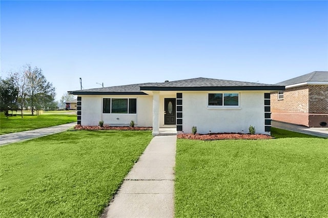 ranch-style house featuring a front lawn