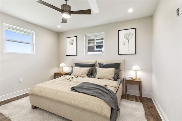 bedroom featuring ceiling fan and dark hardwood / wood-style flooring