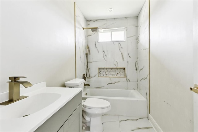 full bathroom with tiled shower / bath, vanity, and toilet