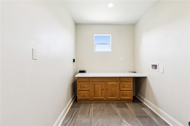 clothes washing area featuring cabinets and washer hookup