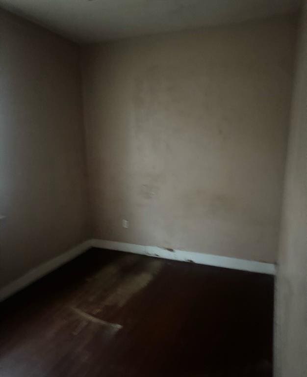 unfurnished room with hardwood / wood-style floors