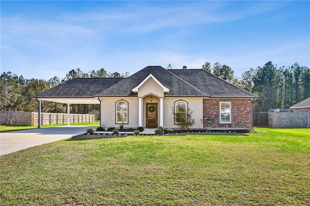 single story home featuring a carport and a front lawn