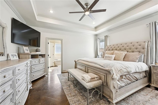 bedroom featuring connected bathroom, a raised ceiling, ceiling fan, and ornamental molding