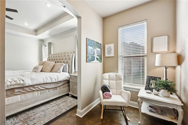 bedroom featuring a raised ceiling and ornamental molding