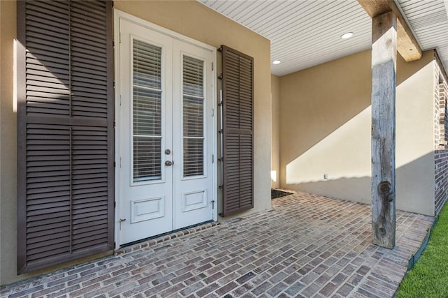 326 Palmer Ct, Slidell, LA 70458 - property entrance featuring french doors, stucco siding, and brick siding