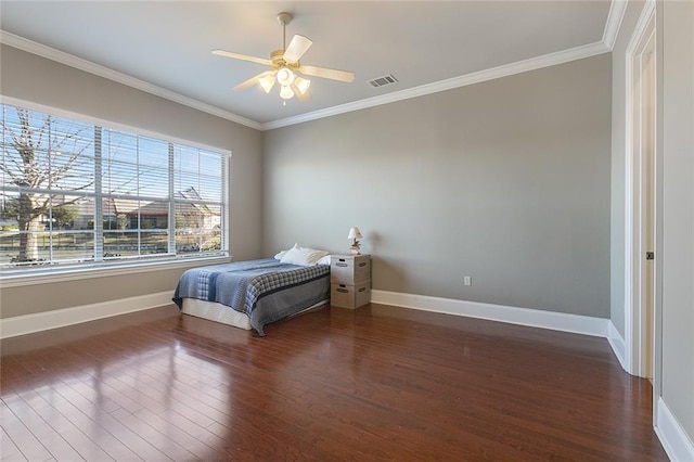 bedroom featuring ceiling fan, crown molding, and dark wood-type flooring