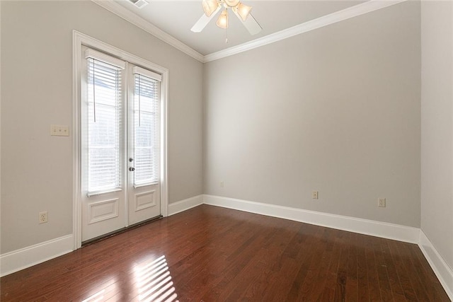 unfurnished room featuring a wealth of natural light, dark hardwood / wood-style flooring, ceiling fan, and ornamental molding