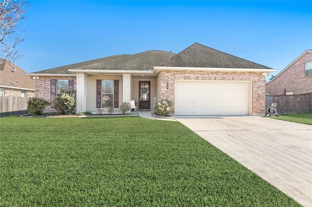 view of front of property with a garage and a front yard