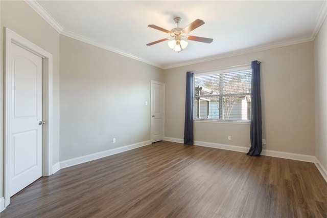 spare room with dark hardwood / wood-style flooring, ceiling fan, and ornamental molding