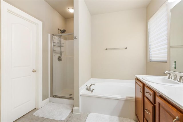 bathroom featuring tile patterned floors, vanity, and independent shower and bath