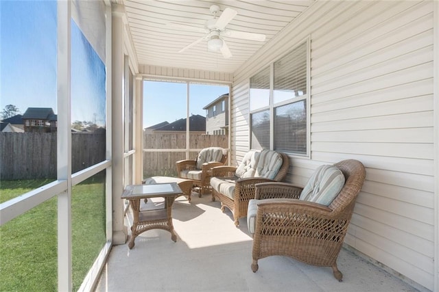 sunroom / solarium with ceiling fan