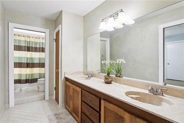 bathroom with walk in shower, vanity, and toilet