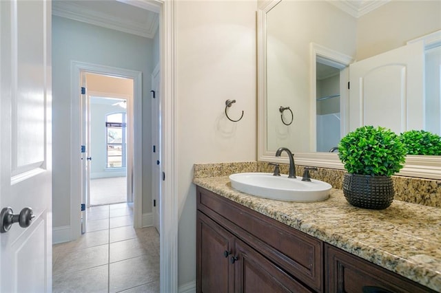 bathroom with vanity, tile patterned floors, and crown molding