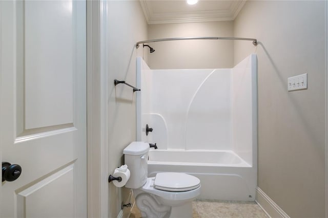 bathroom with toilet, shower / washtub combination, and crown molding