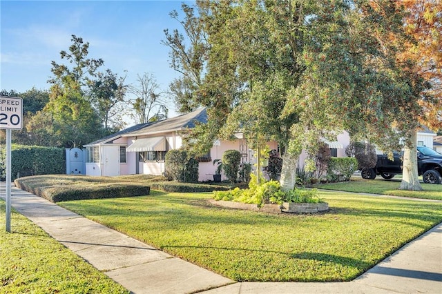 view of front of property with a front lawn