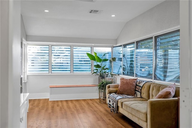 interior space with lofted ceiling and light wood-type flooring