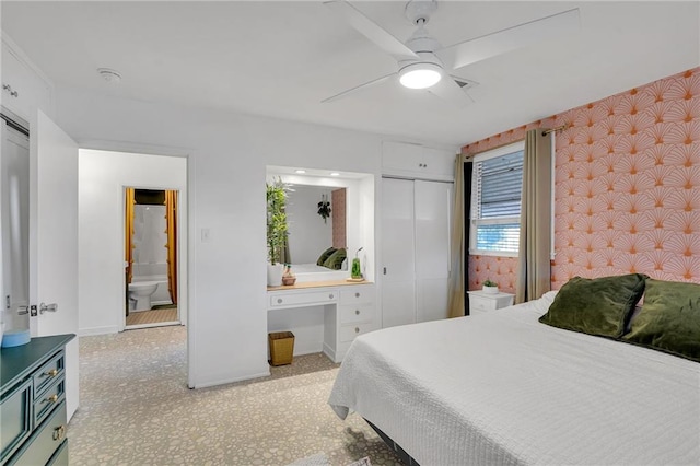 bedroom with ceiling fan and ensuite bath