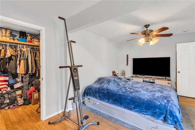 bedroom featuring a closet, ceiling fan, and hardwood / wood-style flooring