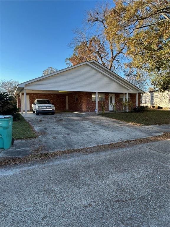 view of side of home featuring a carport