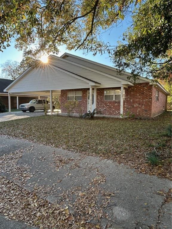 view of front of property featuring a carport