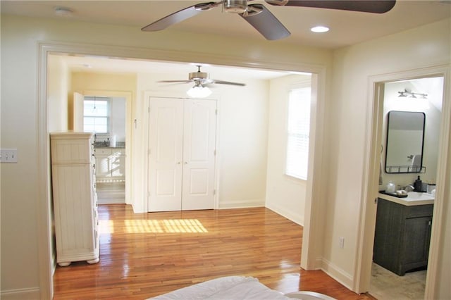 interior space with light hardwood / wood-style floors and sink