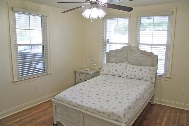 bedroom with ceiling fan and dark wood-type flooring