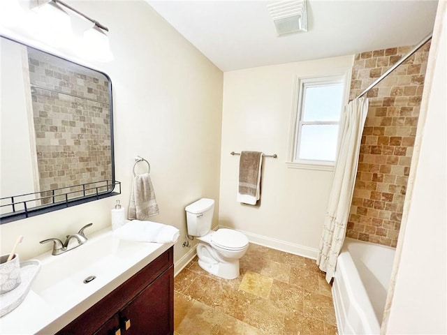 full bathroom with vanity, toilet, and shower / tub combo with curtain