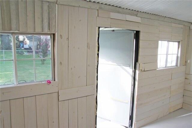 interior space featuring wooden walls