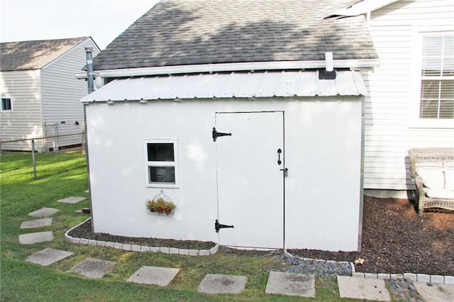 view of outdoor structure with a lawn