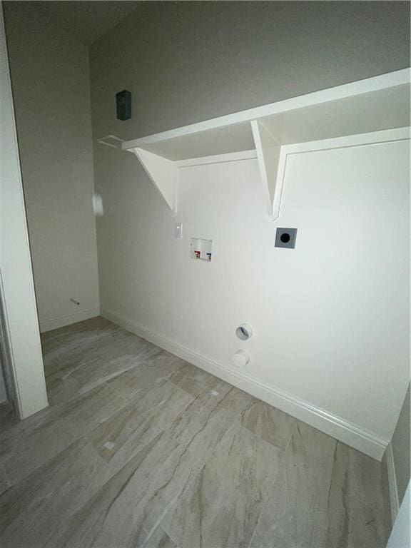 laundry room featuring gas dryer hookup, hookup for a washing machine, and hookup for an electric dryer