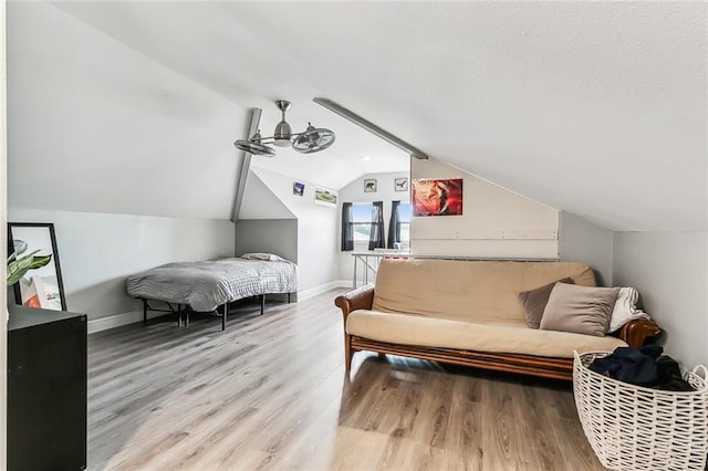 interior space with lofted ceiling and hardwood / wood-style flooring