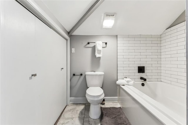 bathroom with toilet and vaulted ceiling