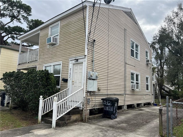 view of side of home with cooling unit