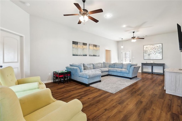 living room featuring dark hardwood / wood-style floors and ceiling fan