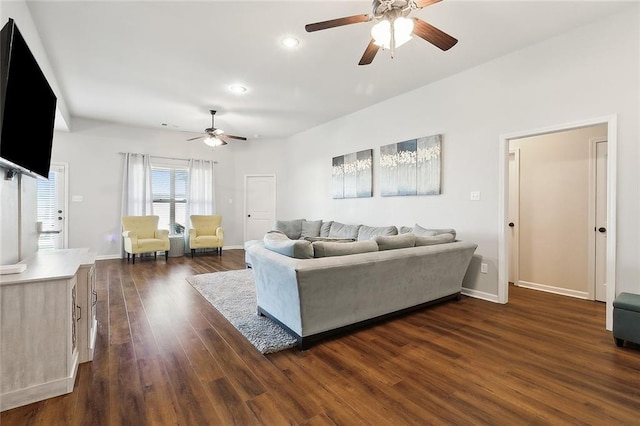 living room featuring dark hardwood / wood-style floors and ceiling fan