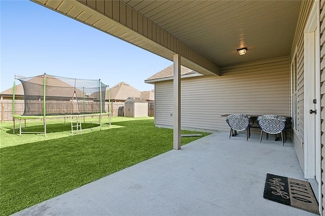 view of patio / terrace featuring a shed and a trampoline