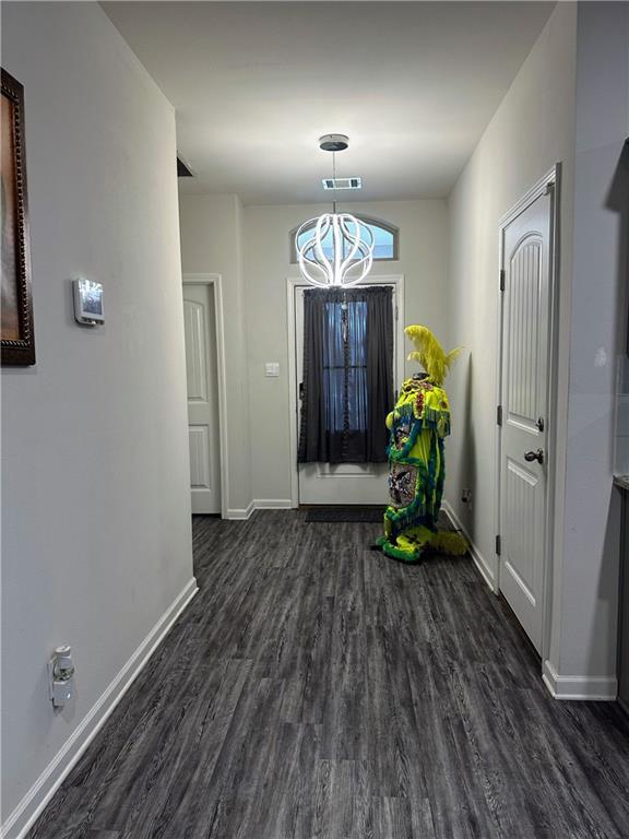 foyer entrance with dark wood-type flooring