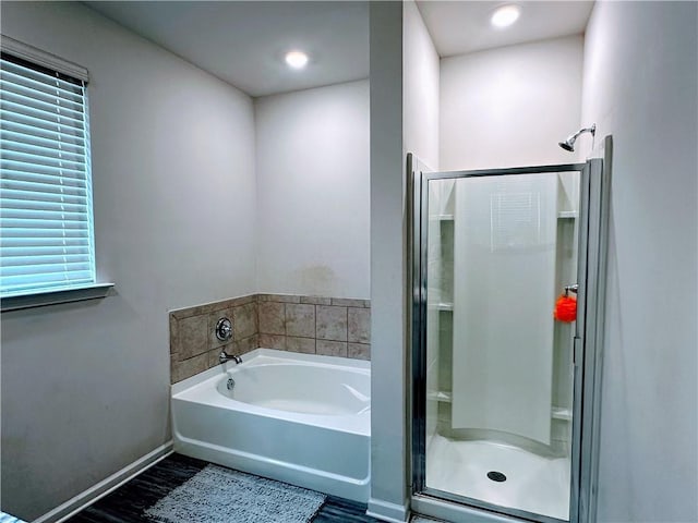 bathroom featuring plus walk in shower