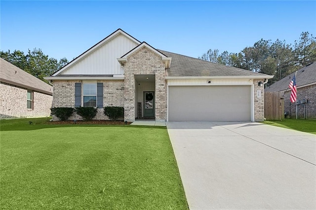 view of front facade with a front yard and a garage