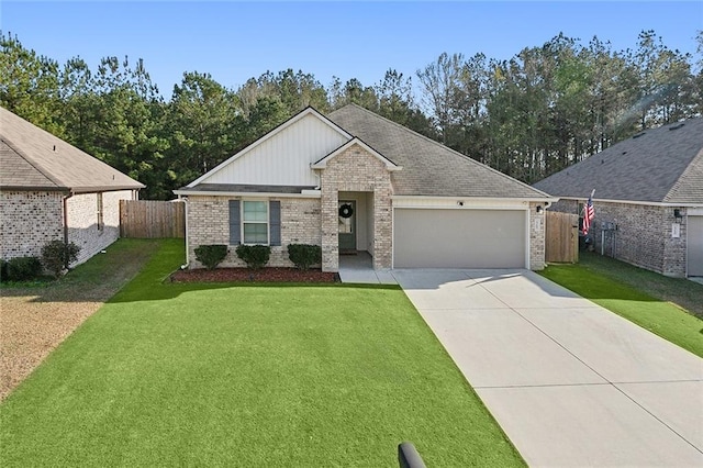 view of front of property with a front yard and a garage