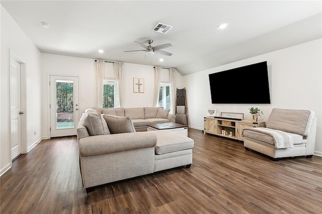 living room featuring vaulted ceiling, ceiling fan, and dark hardwood / wood-style floors