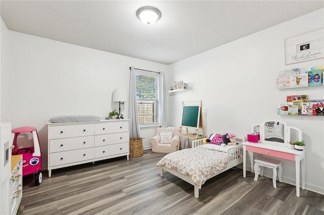 bedroom featuring dark wood-type flooring