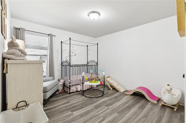 bedroom with wood-type flooring