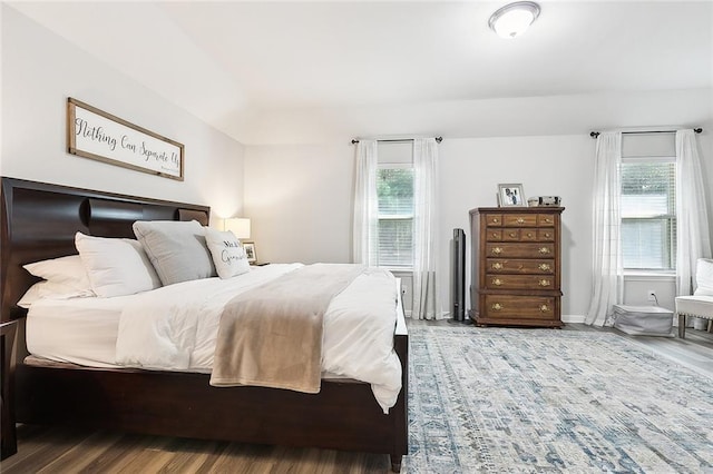 bedroom with hardwood / wood-style flooring