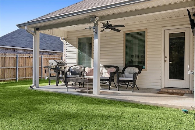 view of patio with area for grilling, ceiling fan, and outdoor lounge area