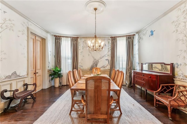 dining space featuring dark hardwood / wood-style floors, ornamental molding, and a notable chandelier