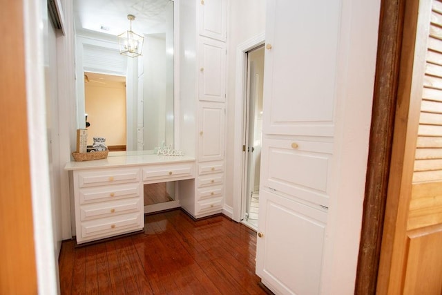 bathroom featuring hardwood / wood-style flooring and a chandelier