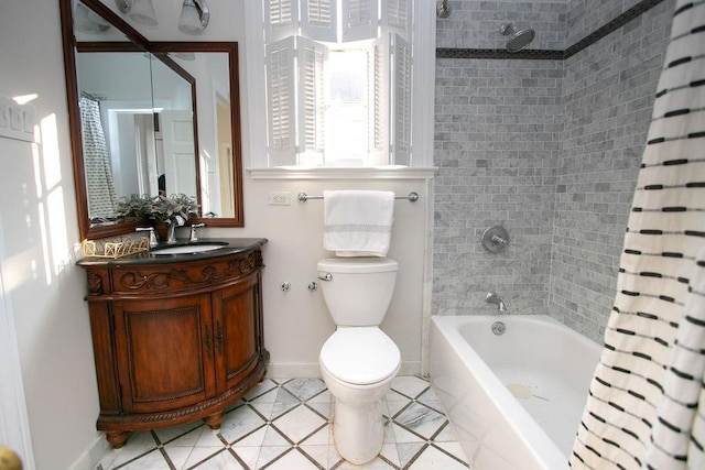 full bathroom with toilet, vanity, and shower / tub combo