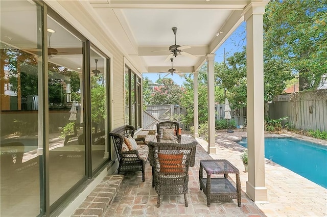 exterior space with a fenced in pool and ceiling fan